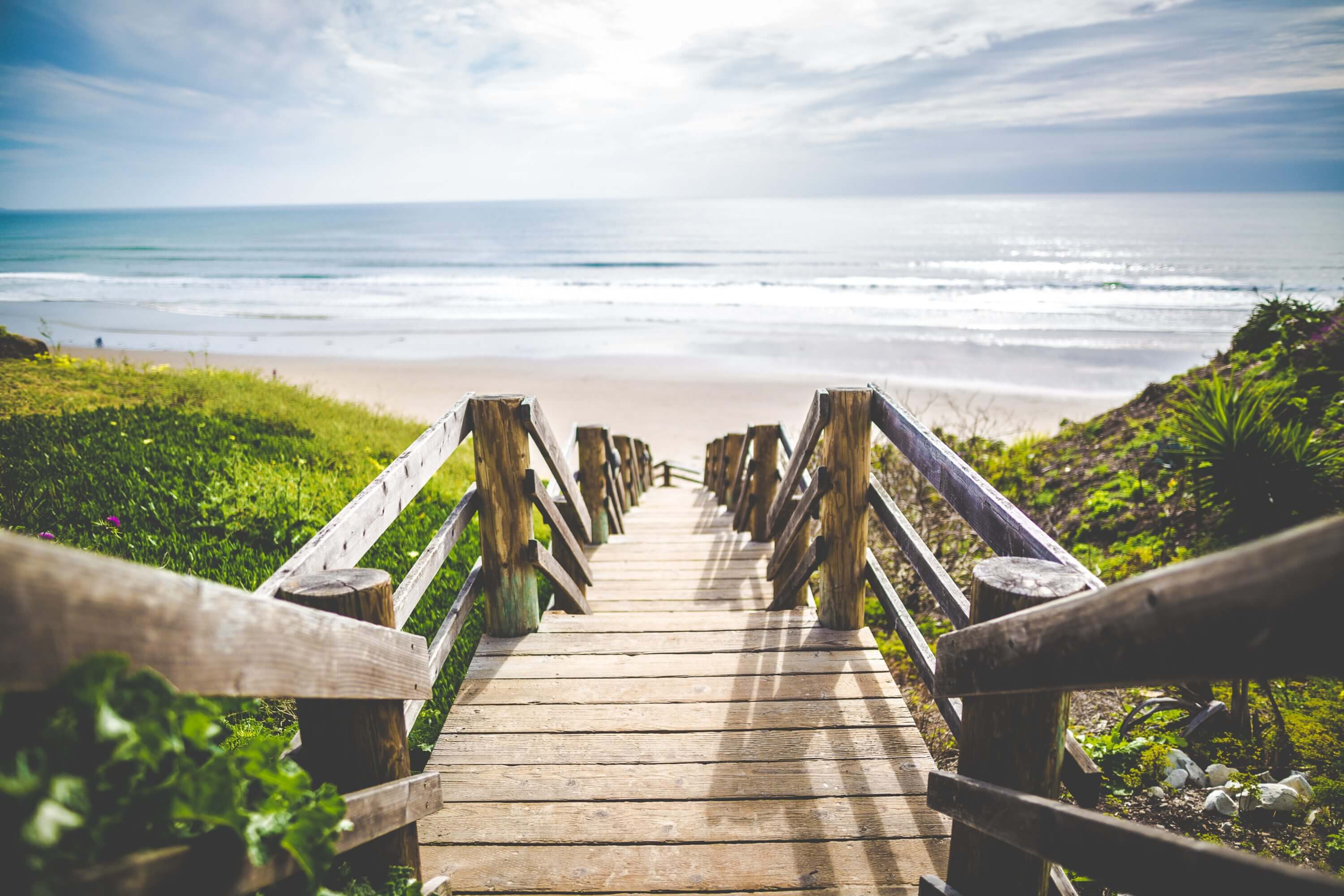 Wooden stairs leading down towards beach